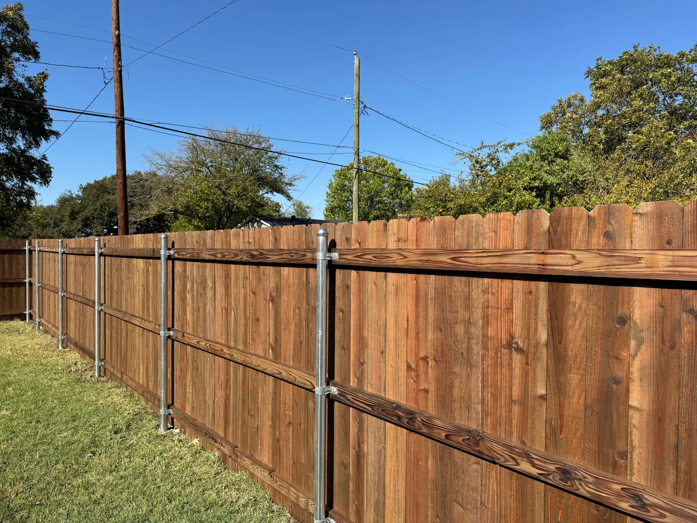 Fence installation crew setting a new fence in Dallas